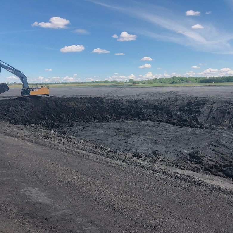 Trench shoring system with an auger boring machine and worker inside the pit
